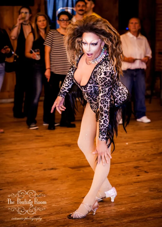 A drag performer posing on the dance floor at Dirty Tea