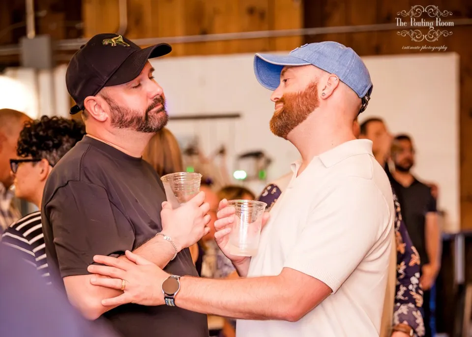 Two guests toasting face to face at Dirty Tea