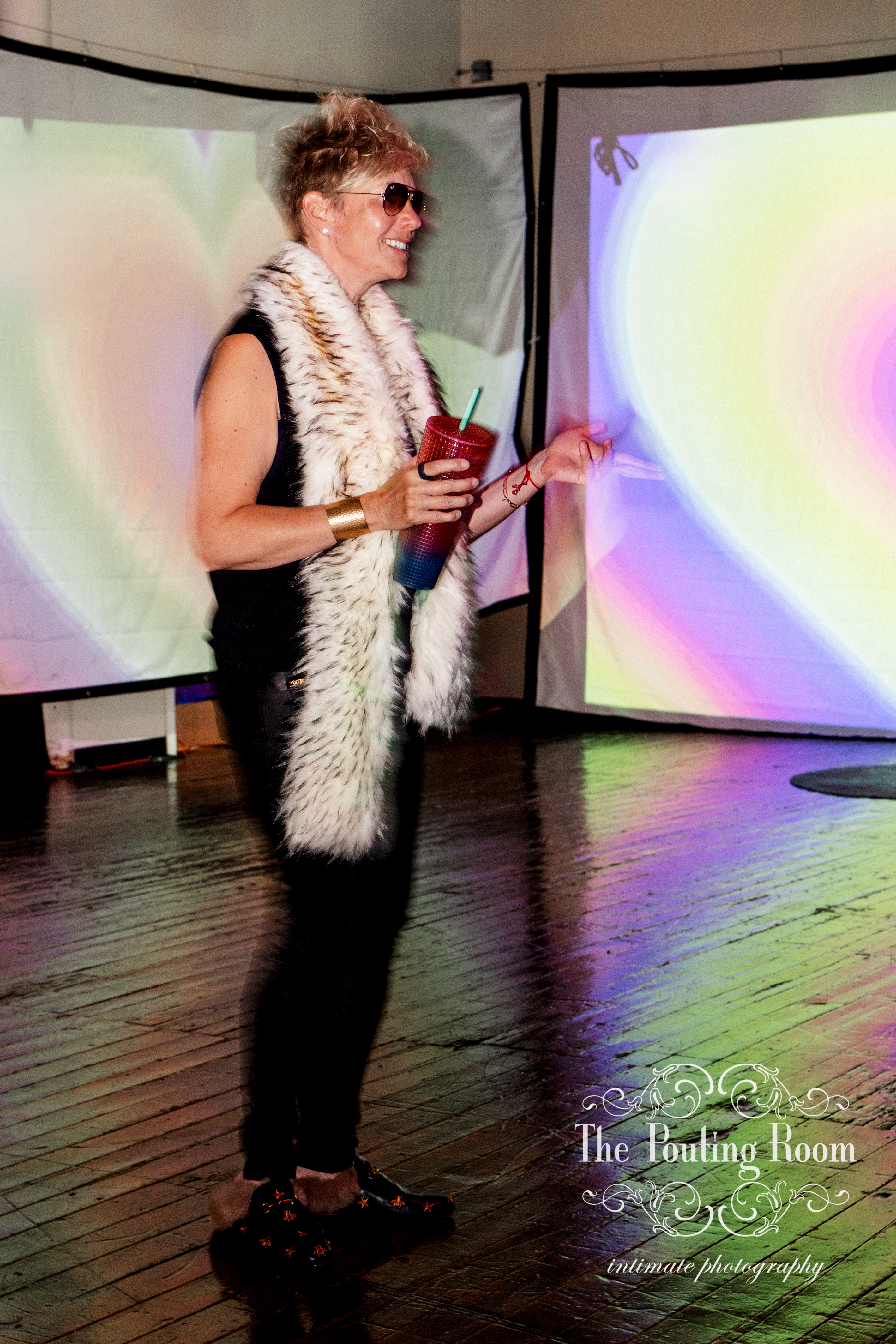 A guest in a fur stole enjoying the afternoon on the dance floor