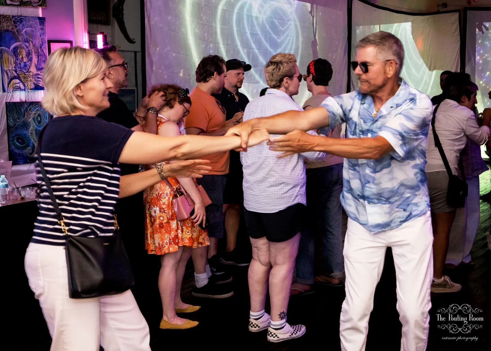 Sunset light over the harbor as guests dance at the Inaugural Tea Dance