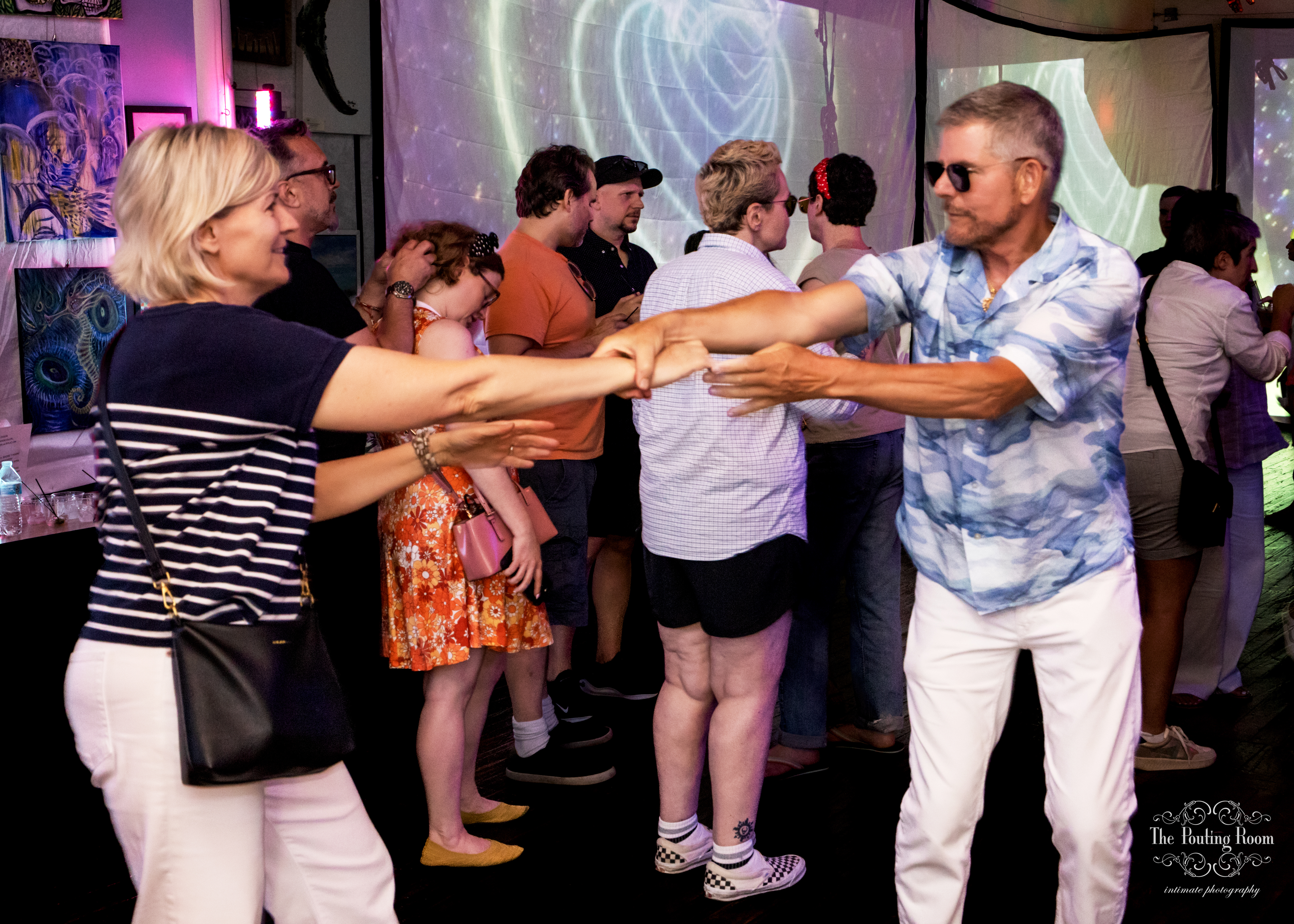 Sunset light over the harbor as guests dance at the Inaugural Tea Dance